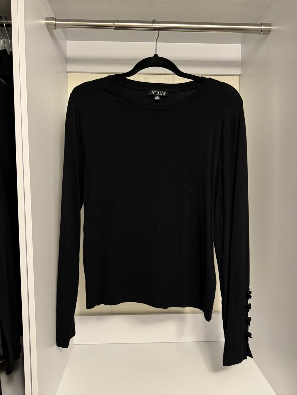 J. Crew Long-Sleeve Black Crewneck Top with velvet bow detailing on sleeve